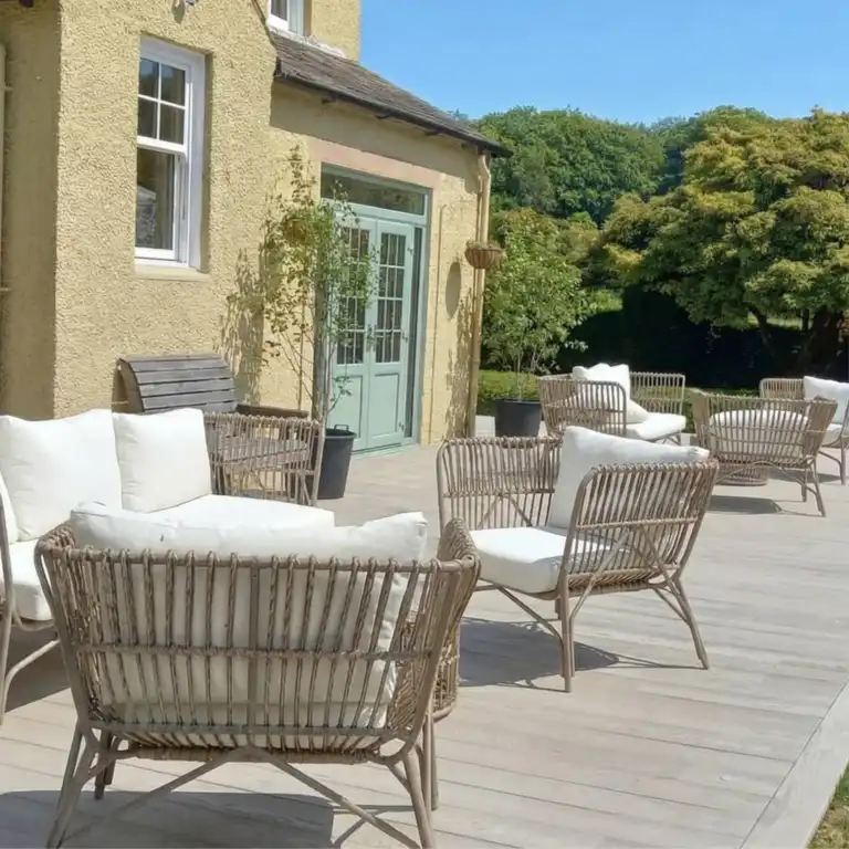 Sun-drenched outdoor terrace seating at Ladyburn House Scotland, built for deep relaxation and community on our Yoga, Meditation and Healing retreat.
