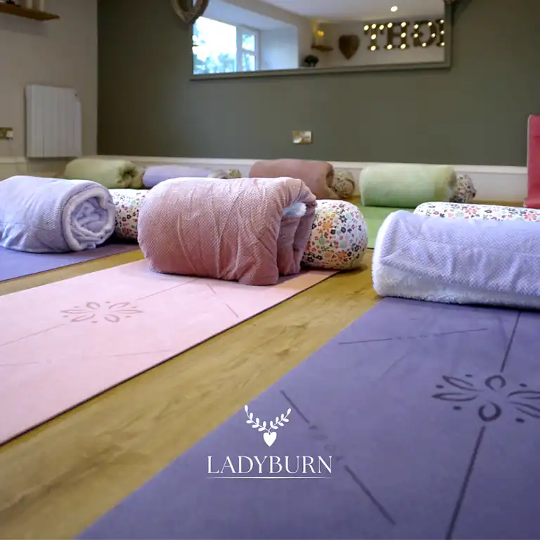 Dedicated therapeutic Yoga, Meditation and Healing studio space at Ladyburn House Scotland, fully styled with mats and bolsters for deep restorative rest.