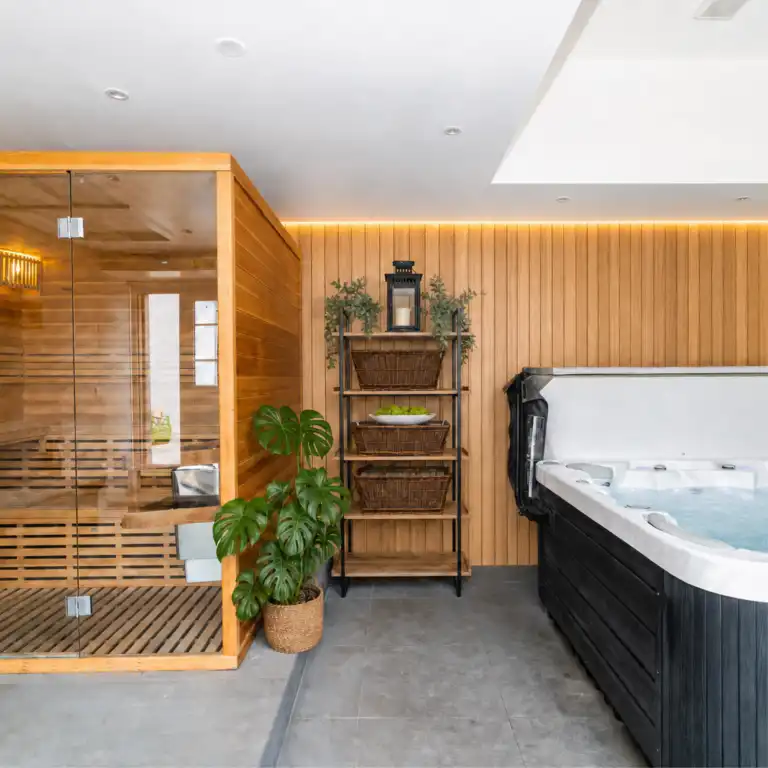 Luxury indoor spa facility at Ladyburn House Scotland, featuring a wooden sauna and hot tub for our Yoga, Meditation and Healing retreat guests.